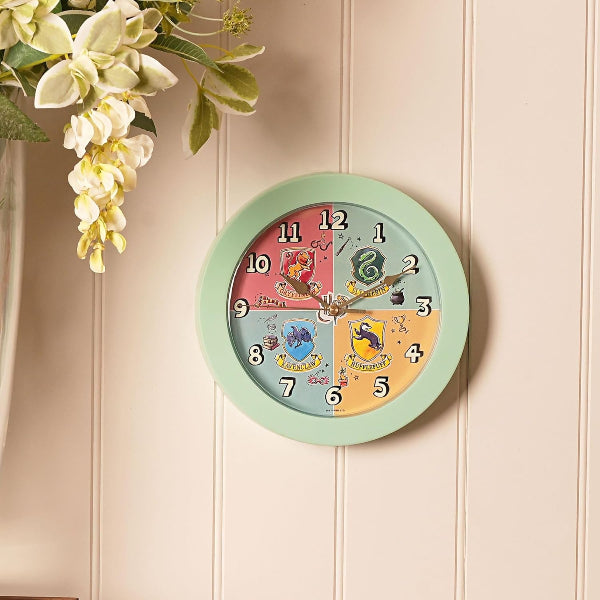 Colorful wall clock with cartoon characters on a light wooden panel background