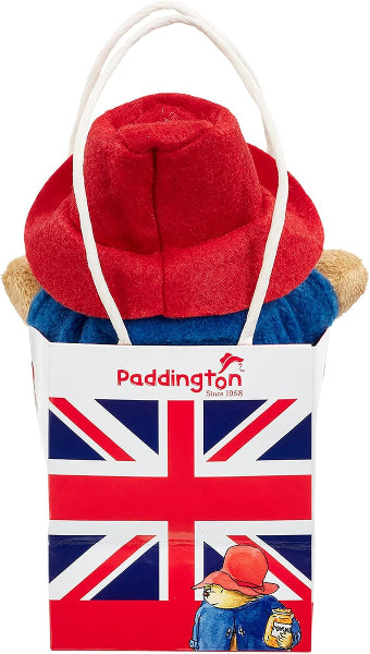 Red hat and blue coat with Paddington Bear branding on a Union Jack bag.