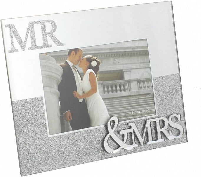 Silver photo frame with 'MR & MRS' text holding a wedding photo of a couple.