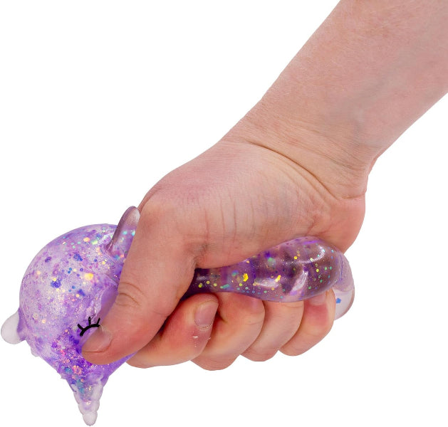 Hand holding a glittery purple stress ball against a white background