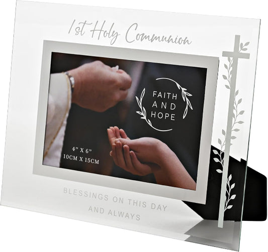 Silver photo frame with '1st Holy Communion' text and hands holding a heart design.
