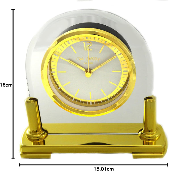 Gold clock with clear dome on a white background