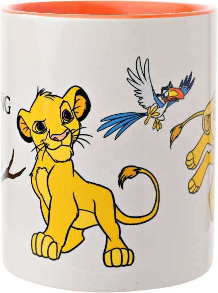 A white ceramic mug with a bright orange interior and exterior rim, featuring cartoon illustrations of Simba the lion cub, Nala, and Zazu from The Lion King.