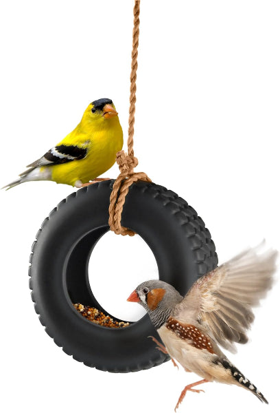 Two birds perched on a tire swing with rope, one yellow and one brown and white, on a white background.
