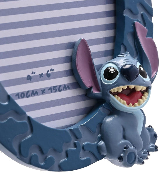 Blue cartoon character in a decorative frame with striped background