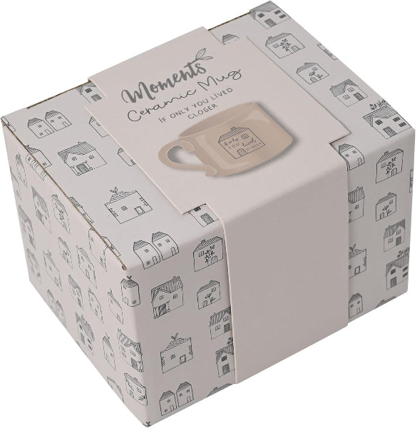 Box packaging for a ceramic mug with decorative design and text on a white background