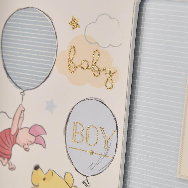 Baby shower card with balloons and 'baby boy' text, featuring cartoon characters.