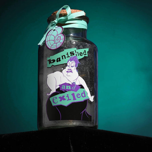 Decorative bottle with a label reading 'banished and exiled' against a teal background