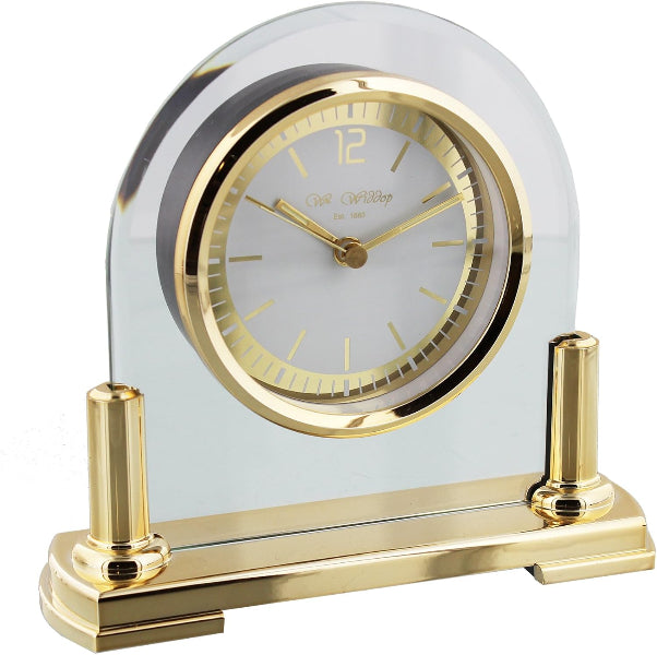 Decorative clock with gold accents on a white background