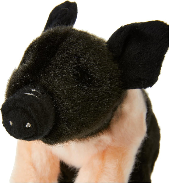 Plush toy pig with black and pink fur on a white background