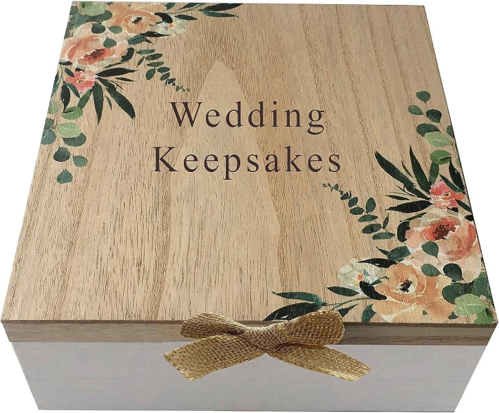 Wooden box with floral designs and 'Wedding Keepsakes' text on a white background