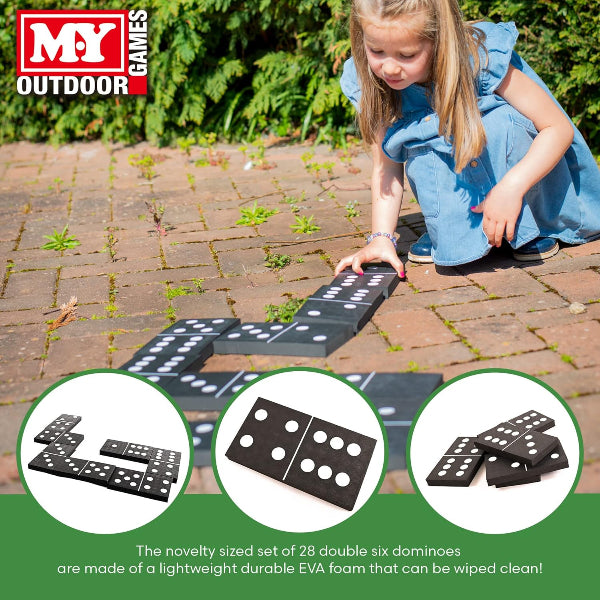 Child playing with outdoor dominoes set on a paved surface, with M&Y Outdoor Games branding.