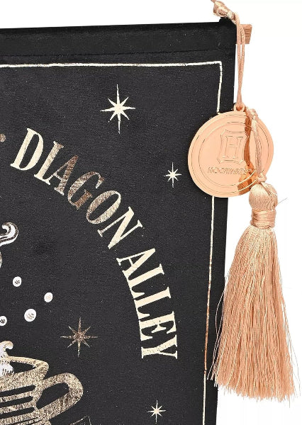 Black bag with 'Diagon Alley' text and gold tassel, featuring a Harry Potter theme.