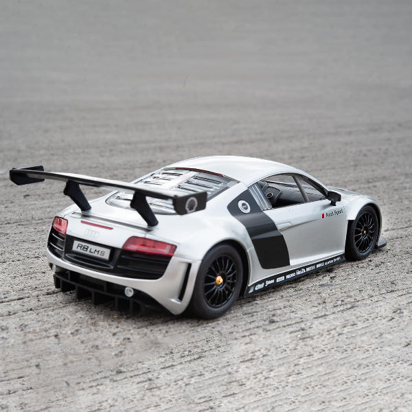 White sports car with black accents on a gray surface