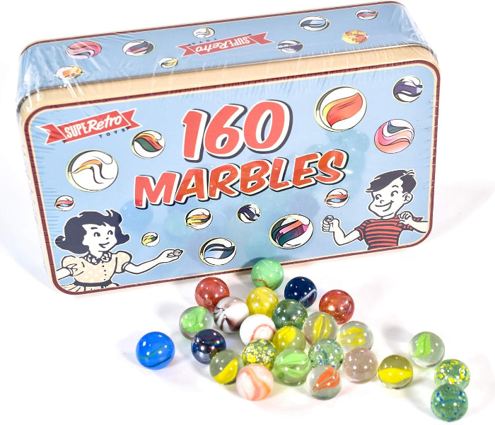 Retro-style tin box with marbles spilling out on a white background