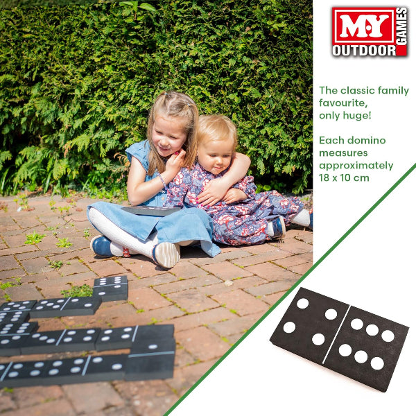 Two children playing with oversized dominoes on a patio, with MY Outdoor Games branding.