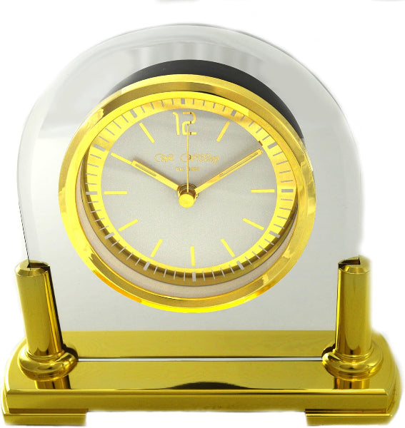 Decorative clock with gold and clear design on a white background