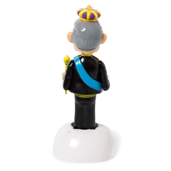 Figurine of a character in formal attire with a crown on a white background
