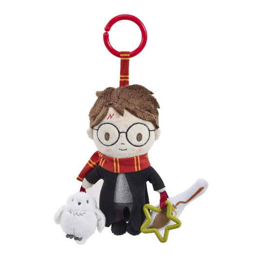 Plush toy resembling a character from a popular franchise with a red broomstick on a white background