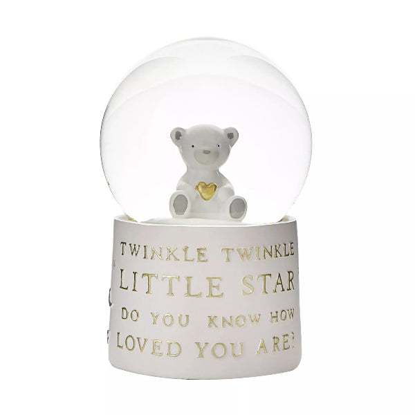 Decorative snow globe with a white bear and text on a white background