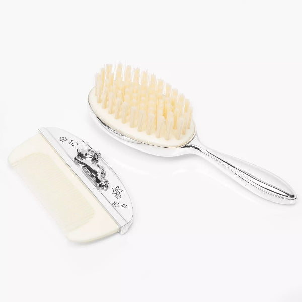 Two brushes with white bristles and silver handles on a white background