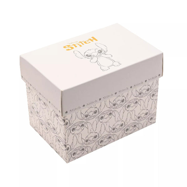 A square white storage box featuring Disney Stitch graphics, including the character name in yellow on the lid and a repeating pattern of Stitch on the sides.