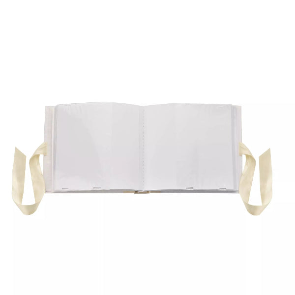 White book with beige straps on a white background