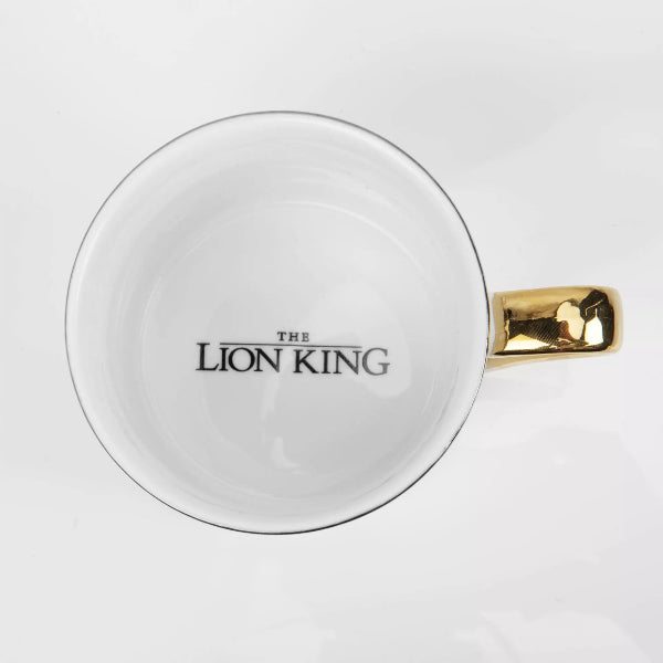 White mug with gold handle featuring 'The Lion King' logo on a white background