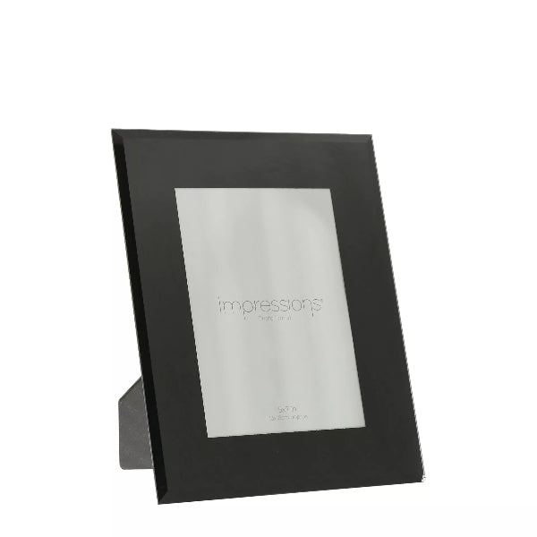 Black photo frame with 'Impressions' branding on a white background