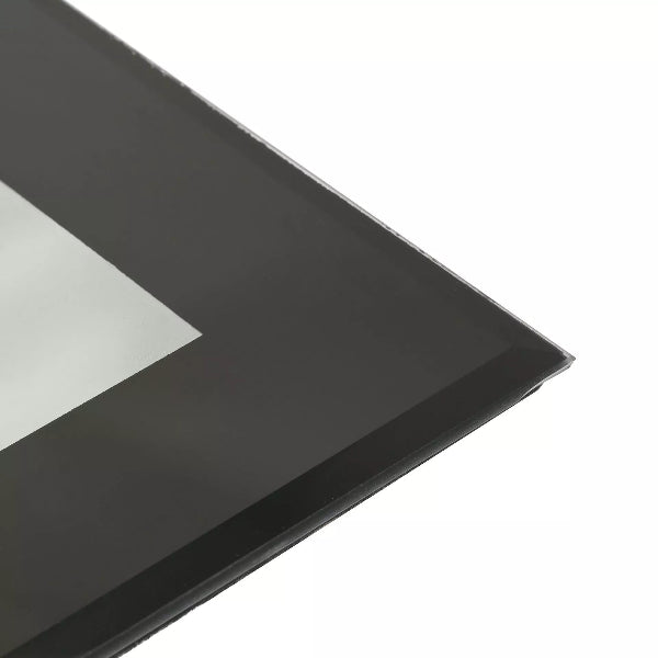 Black rectangular object with a reflective surface on a white background
