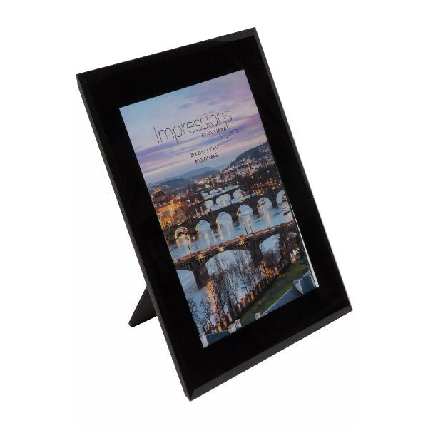 Black photo frame with a scenic print on a white background