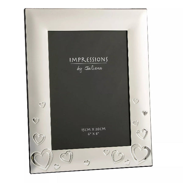 Silver photo frame with heart designs on a white background