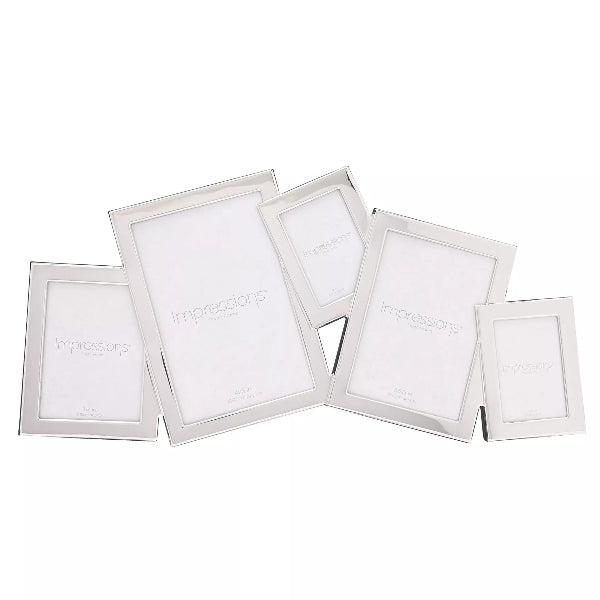 A set of five silver picture frames in different sizes, arranged in a fan shape on a plain white background. The center of each frame features a white insert card printed with the brand name 'Impressions'.