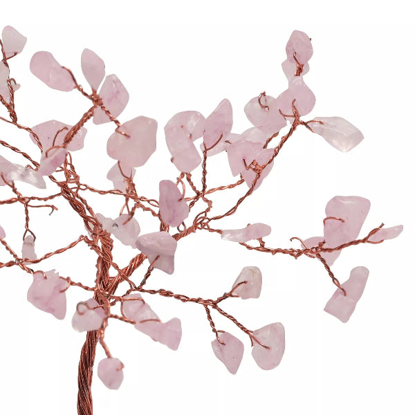 Decorative branch with pink leaves and copper wire on a white background