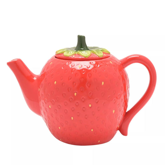 Red strawberry-shaped teapot on a white background