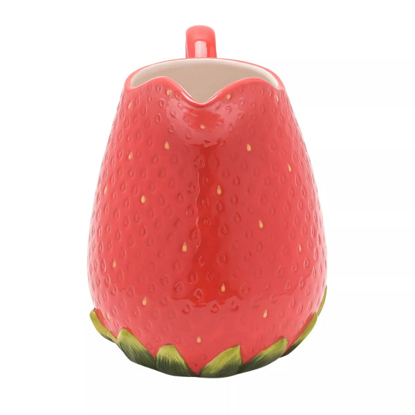 Red strawberry-shaped ceramic pitcher on a white background