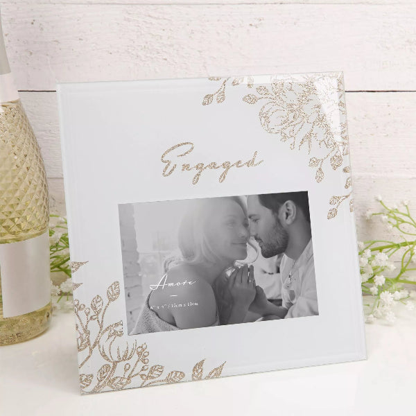 Decorative photo frame with floral design and 'Engaged' text on a white background