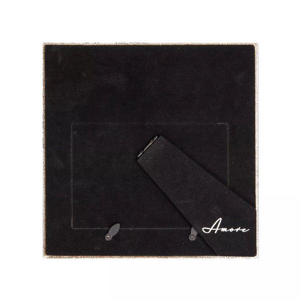 Black jewelry box with a ribbon and 'Amore' text on a white background