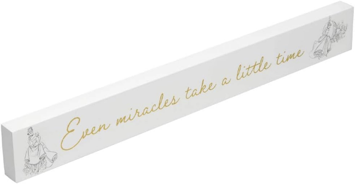 Decorative sign with motivational quote 'Even miracles take a little time' on a white background