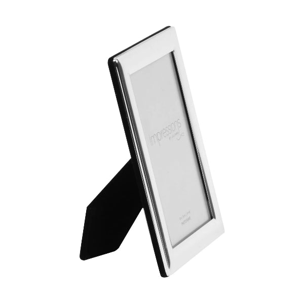 Silver photo frame with a black stand on a white background