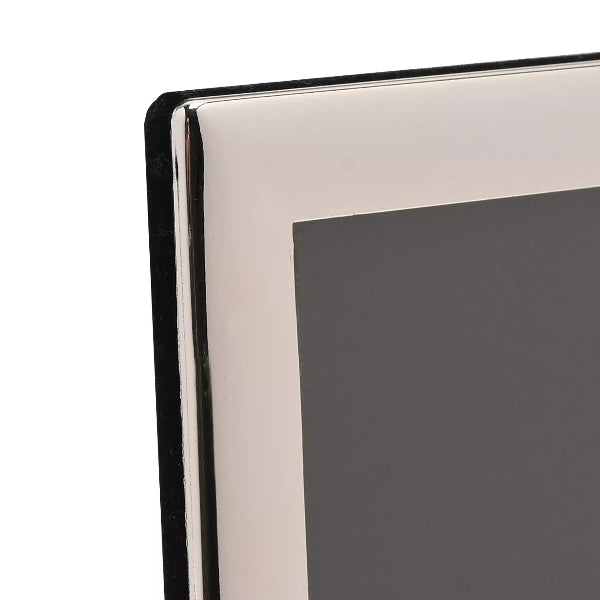 Close-up of a silver photo frame corner on a white background