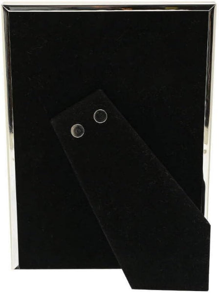 Black rectangular object with metallic corners on a white background