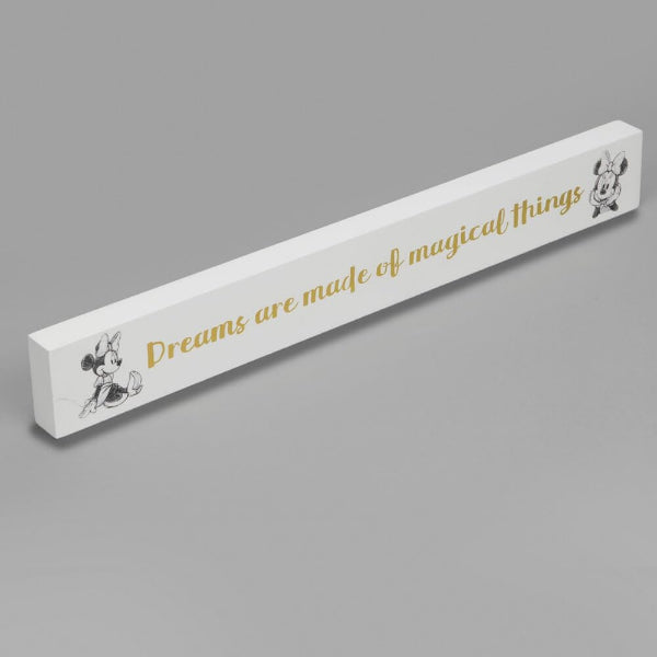 White rectangular sign with gold text and cartoon character on a gray background