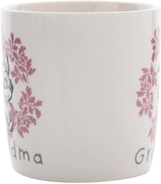 White mug with pink floral patterns and 'Grandma' text on a white background