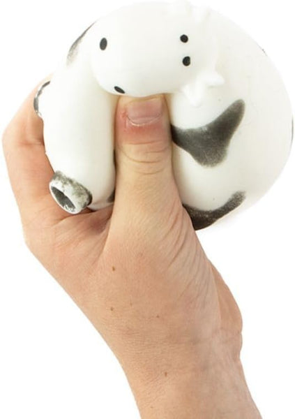 Hand holding a white stress ball with black accents on a white background