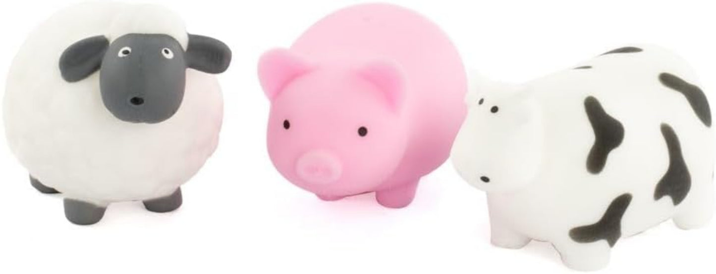 Three small animal figurines: a sheep, a pig, and a cow, on a white background.