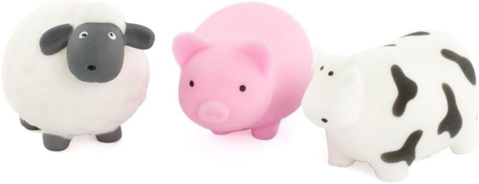 Three small animal figurines: a sheep, a pig, and a cow, on a white background.