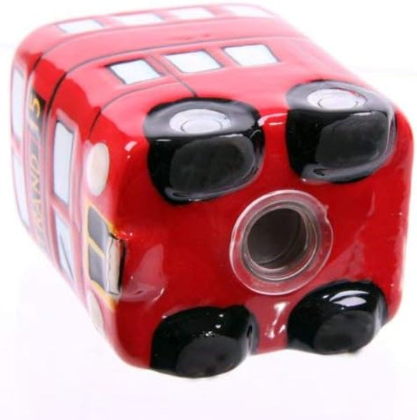 Red toy bus with black wheels on a white background