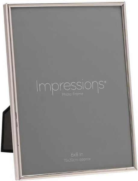 A silver-toned metal picture frame with a black interior insert and a small black side support, shown on a white background. The insert reads 'Impressions Photo Frame' and '6x8 in / 15x20cm approx'.