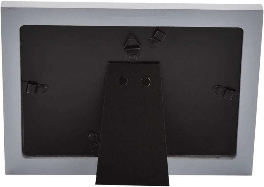 The back view of a picture frame with a silver outer border and a black mounting plate and stand.
